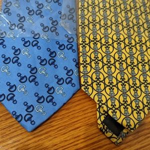 Two blue and yellow patterned silk ties.